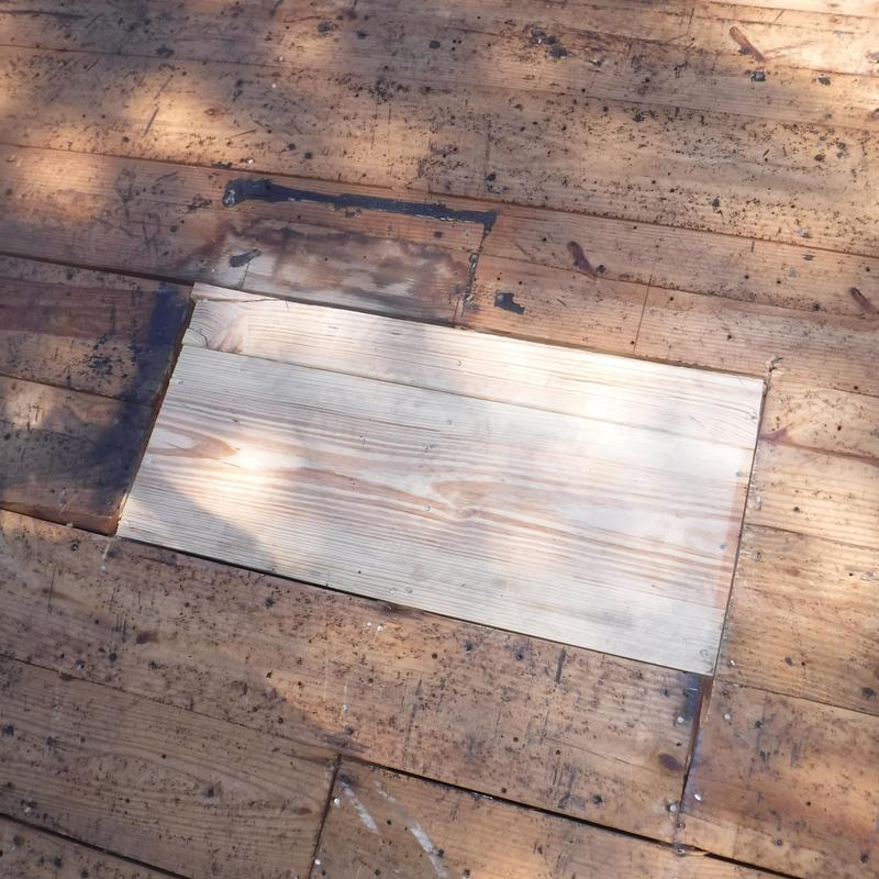 Roof decking repair with new wood plank replacement
