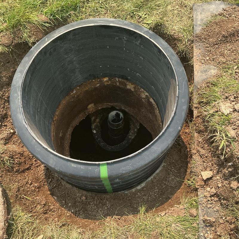 Pump riser and lid inspection in soil and grass area Pump riser and lid inspection in soil and grass area