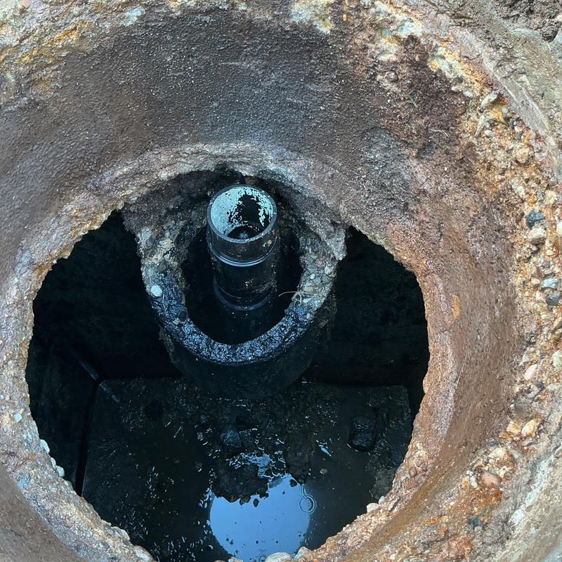 Septic pump riser and lid inspection with water inside Septic pump riser and lid inspection with water inside