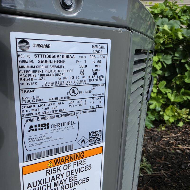 Trane 5TTR3060A1000AA air conditioner unit label close-up Trane 5TTR3060A1000AA air conditioner unit label close-up