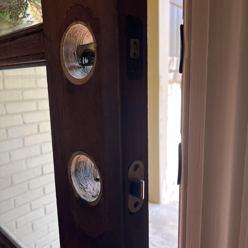 Wooden door lock holes for knob and latch installation Wooden door lock holes for knob and latch installation