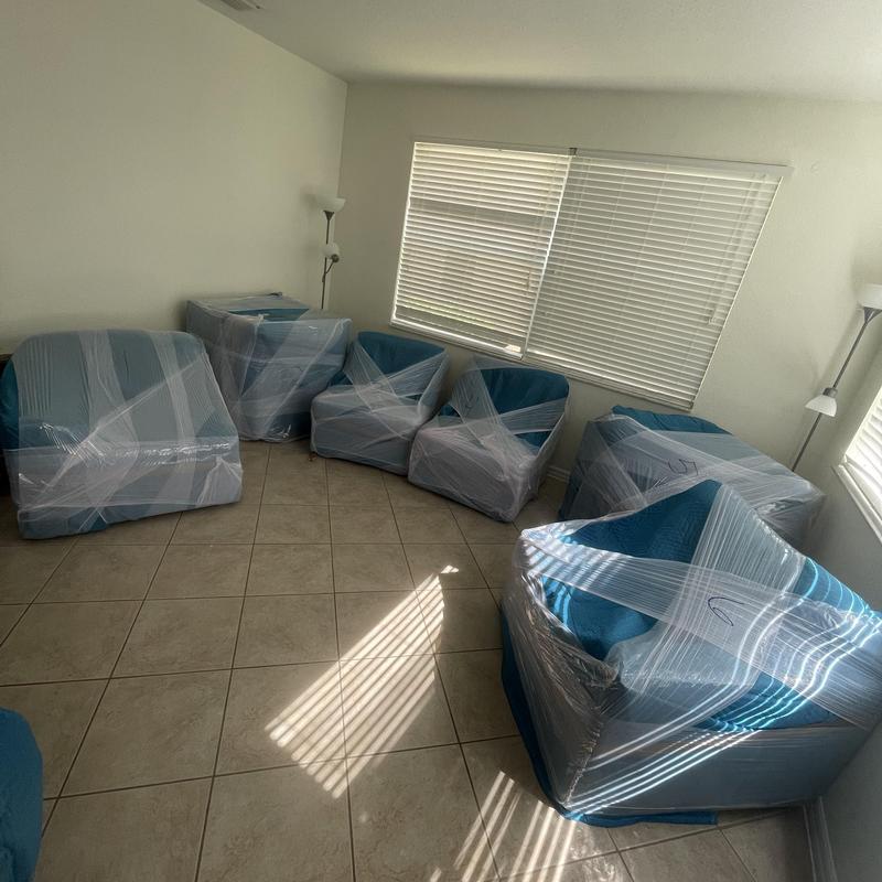 Wrapped blue upholstered chairs for local move packaging