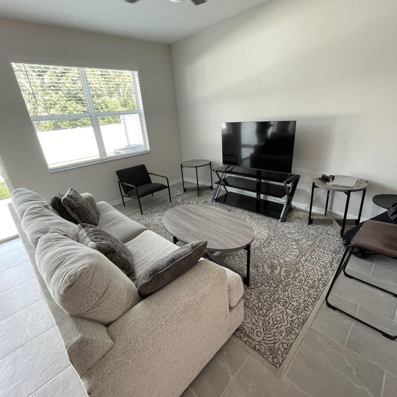 Living room furniture setup with TV and coffee table