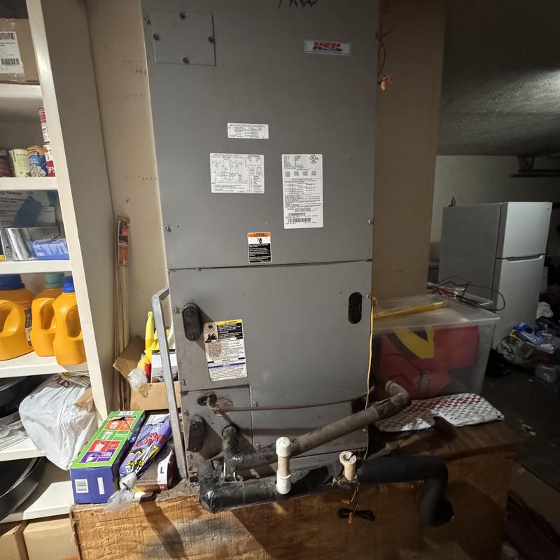 Heat pump split system air handler with pipe connections