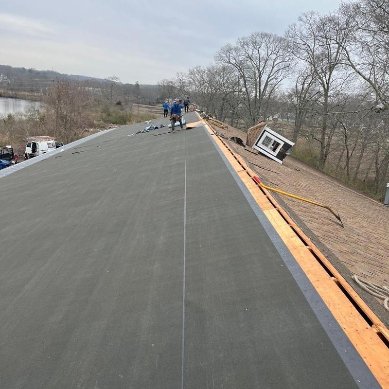 Ice and water shield installation on new roof decking Ice and water shield installation on new roof decking