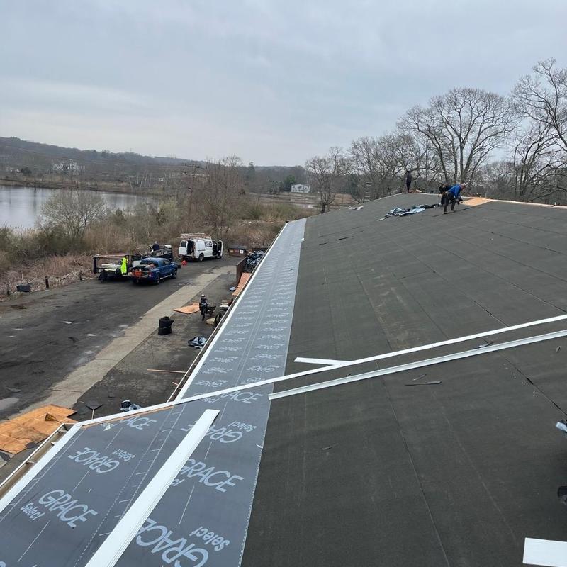 Ice and water shield installation on steep roof slope Ice and water shield installation on steep roof slope