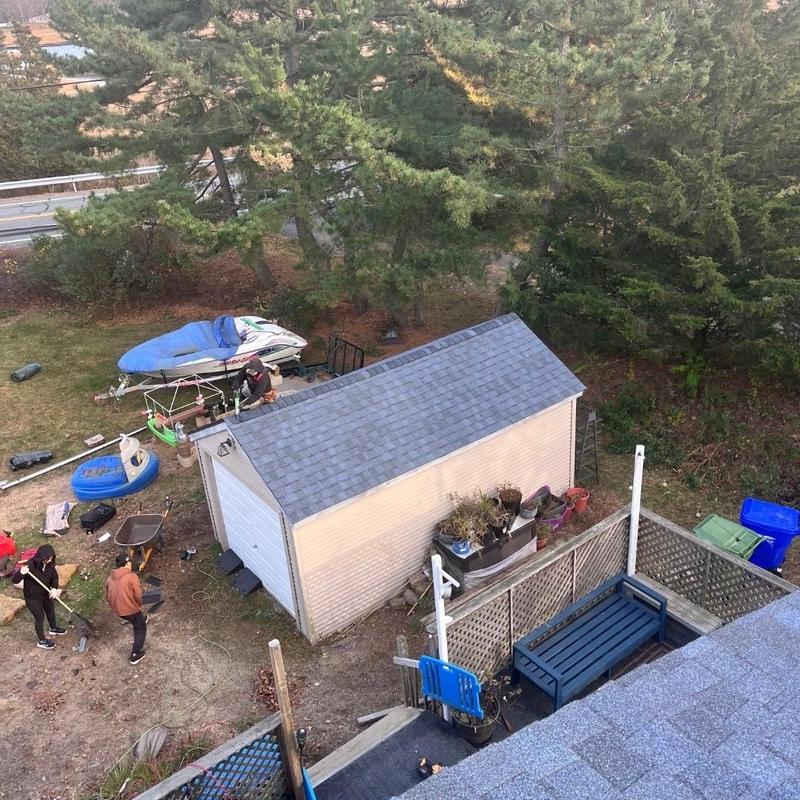 New roof shingles installation on backyard shed New roof shingles installation on backyard shed
