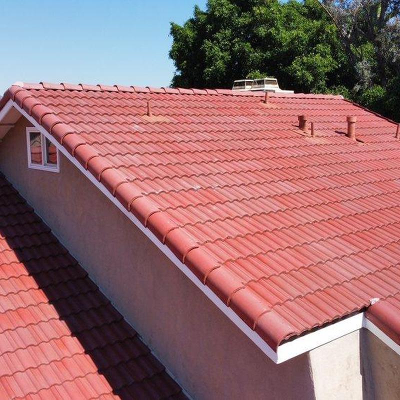 Tile roof with ventilation pipes under clear sky Tile roof with ventilation pipes under clear sky