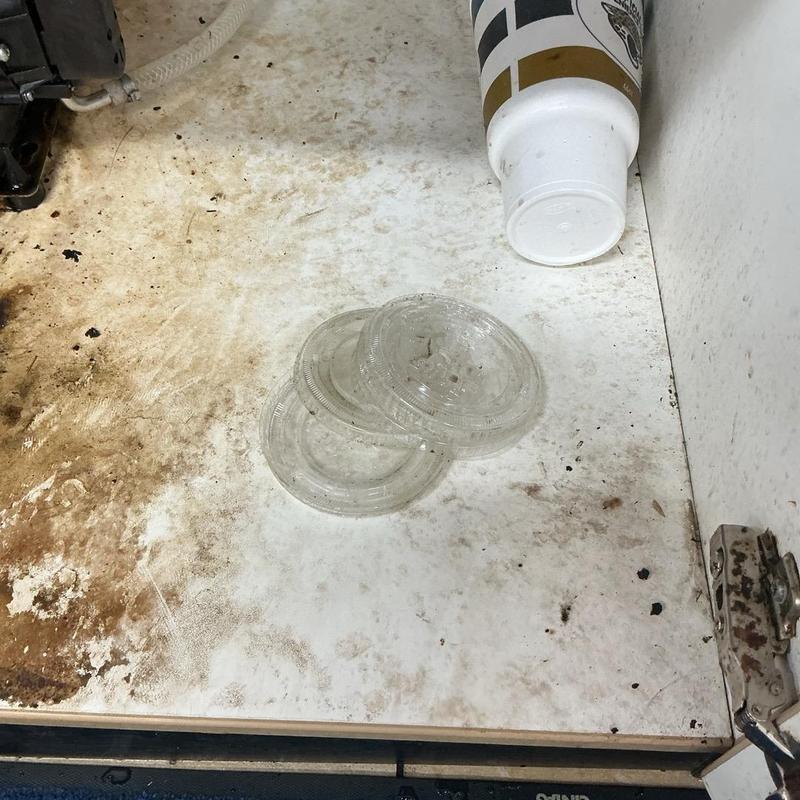 Floor drain plastic lids removed, dirty cabinet shelf Floor drain plastic lids removed, dirty cabinet shelf