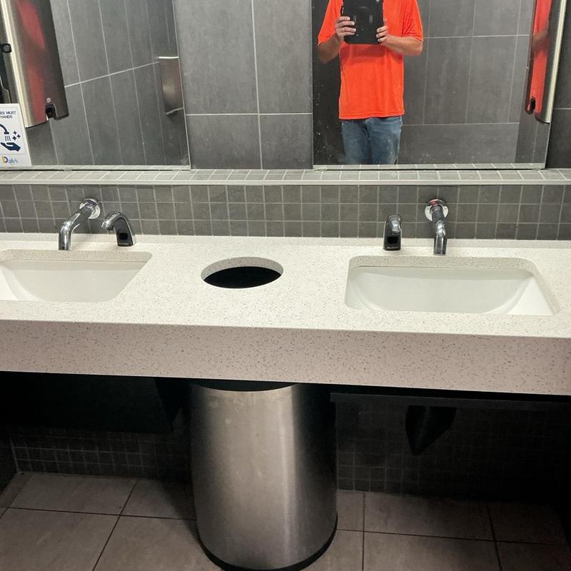 Soap dispenser with sinks in restroom counter Soap dispenser with sinks in restroom counter