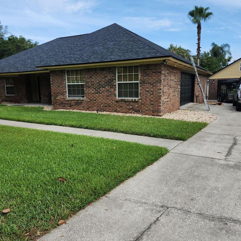 Owens Corning Onyx Black roof shingles on brick house Owens Corning Onyx Black roof shingles on brick house