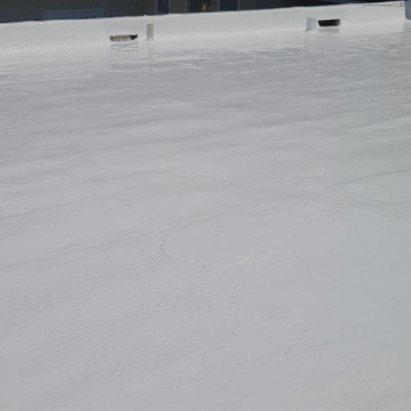 Tremco silicone coating on office roof deck Tremco silicone coating on office roof deck
