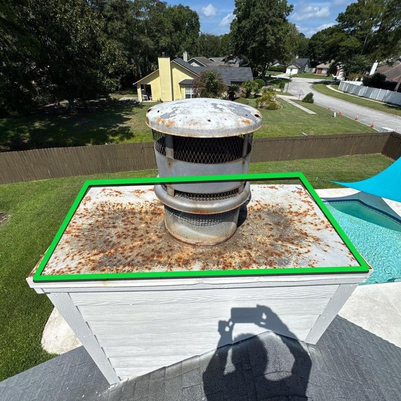 Chimney chase cover with rusted flue cap Chimney chase cover with rusted flue cap