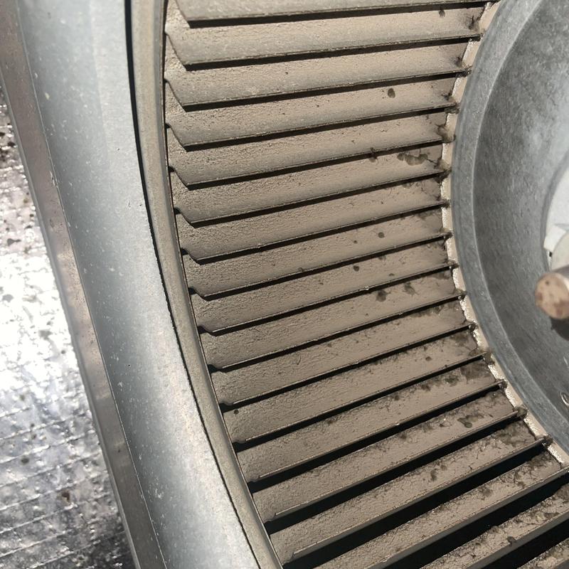 Heat pump blower wheel with accumulated dust buildup
