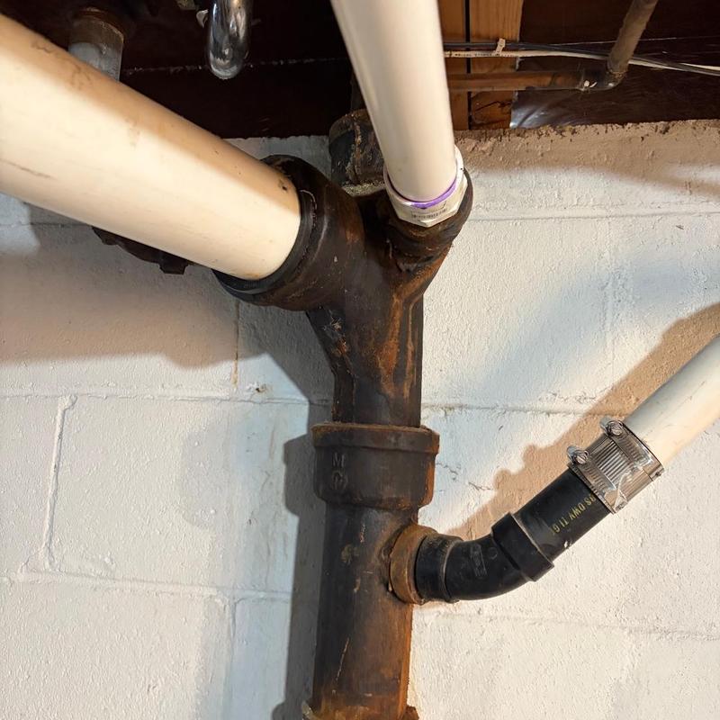 Cast iron stack pipe with PVC and hose bib connections Cast iron stack pipe with PVC and hose bib connections