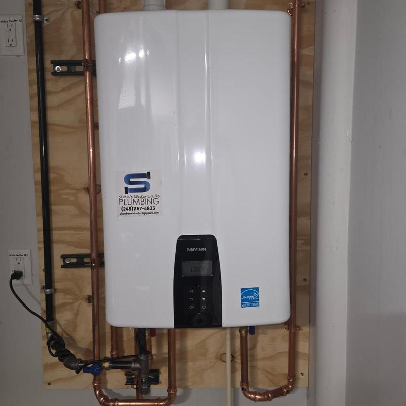 Navien 240a2 tankless water heater with piping installed
