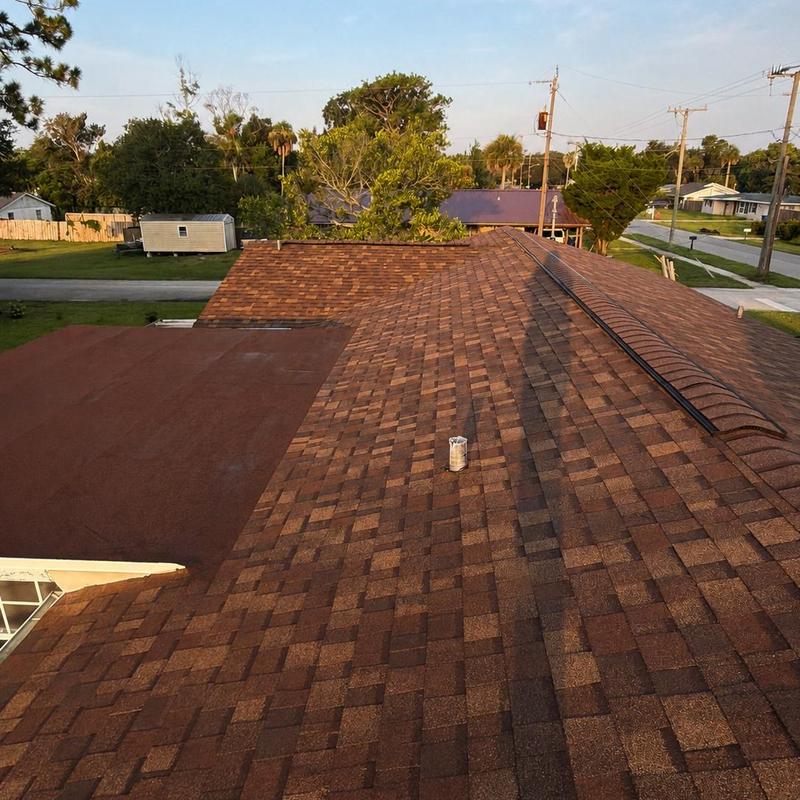 Owens Corning Desert Rose shingle roof with bitumen flat section Owens Corning Desert Rose shingle roof with bitumen flat section