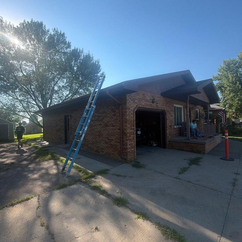 Brick residential roof with ladder for inspection Brick residential roof with ladder for inspection
