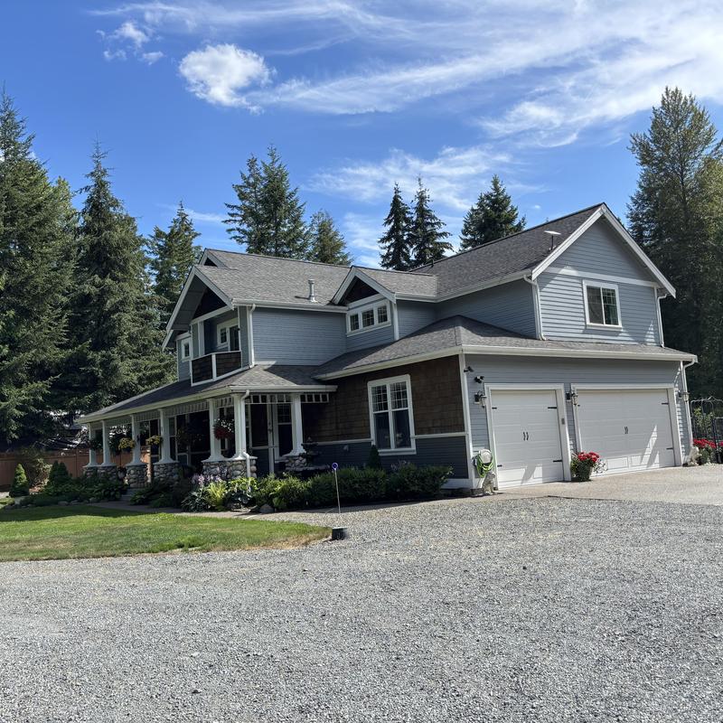 Asphalt shingle roof on two-story residential home Asphalt shingle roof on two-story residential home