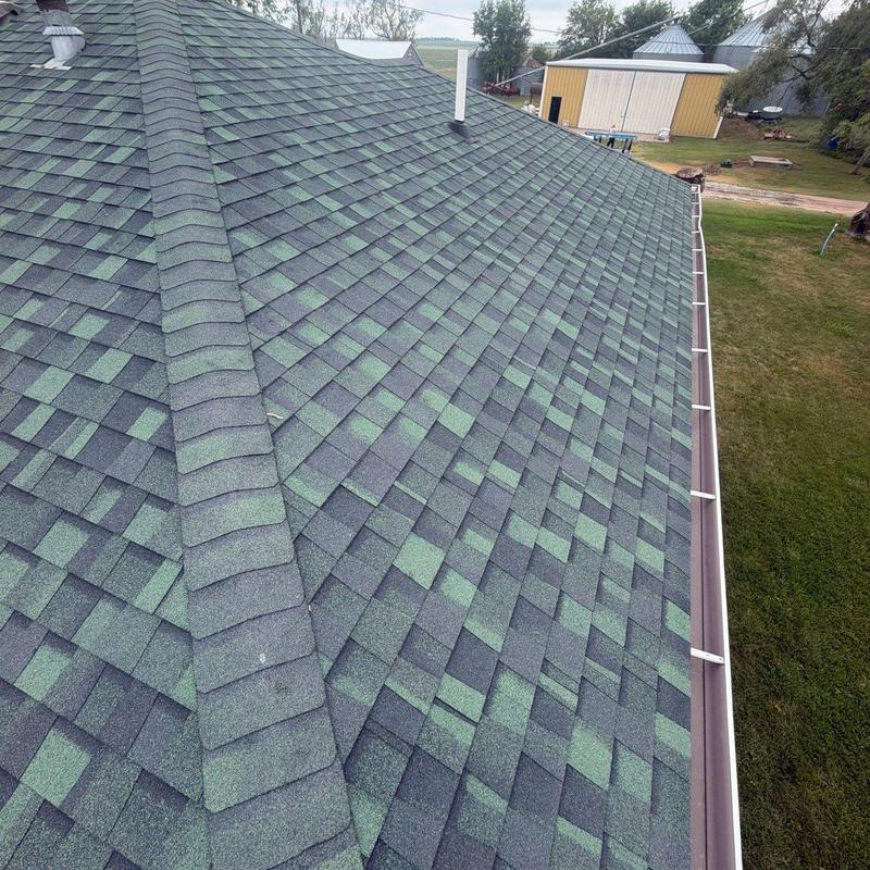 Asphalt shingle roof with gutter system and vent pipe Asphalt shingle roof with gutter system and vent pipe