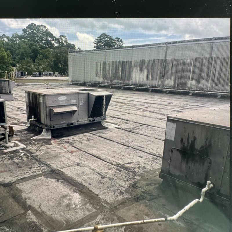 Rooftop HVAC units on flat commercial roof