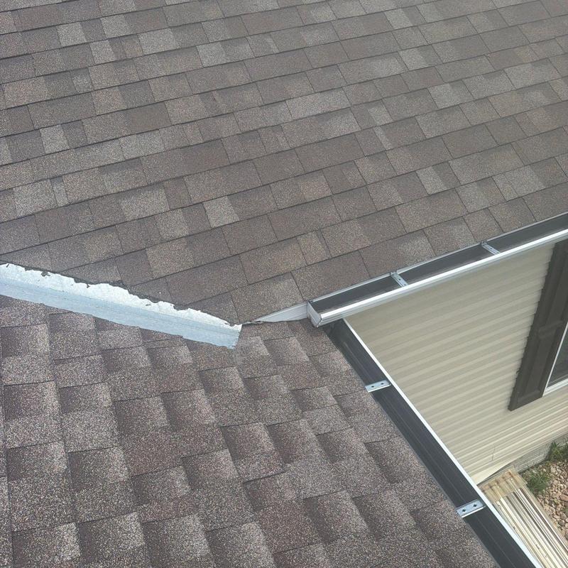 Asphalt shingle roof with metal flashing and gutter system Asphalt shingle roof with metal flashing and gutter system