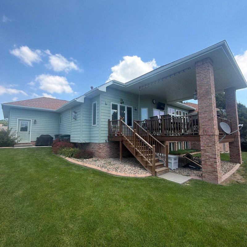 Roof shingles and covered wooden deck with stairs Roof shingles and covered wooden deck with stairs