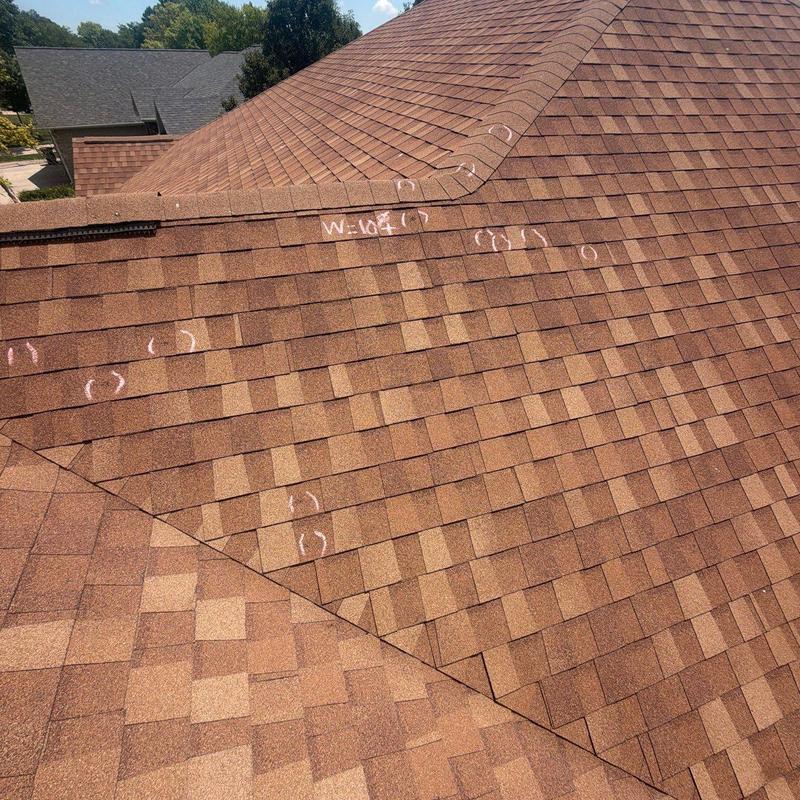 Asphalt shingle roof with chalk markings for inspection Asphalt shingle roof with chalk markings for inspection