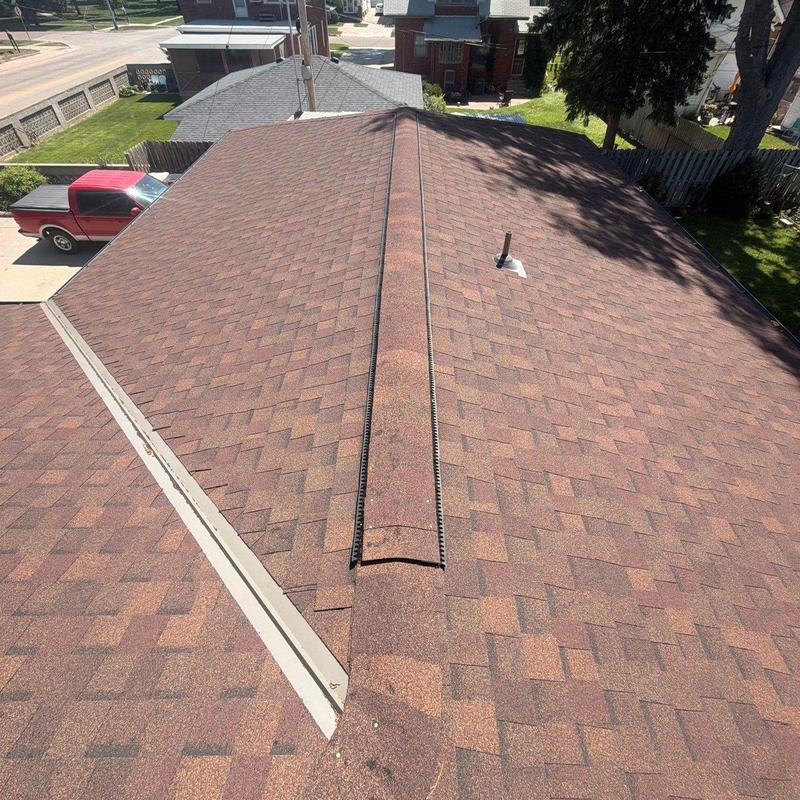 Asphalt shingle roof with ridge vent in Hastings, NE Asphalt shingle roof with ridge vent in Hastings, NE