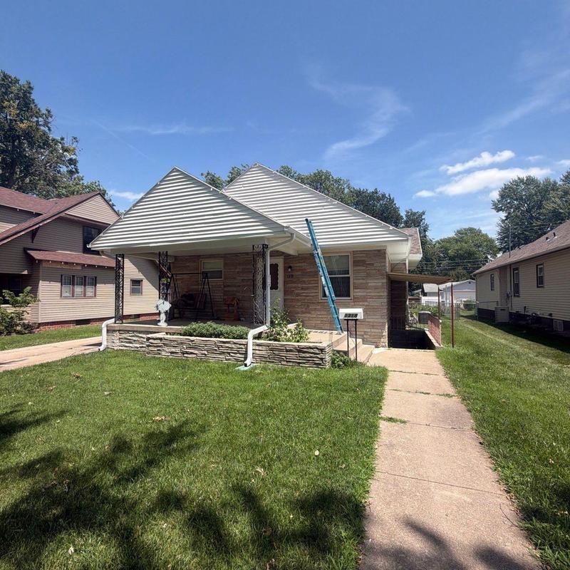 Residential shingle roof with ladder for inspection Residential shingle roof with ladder for inspection