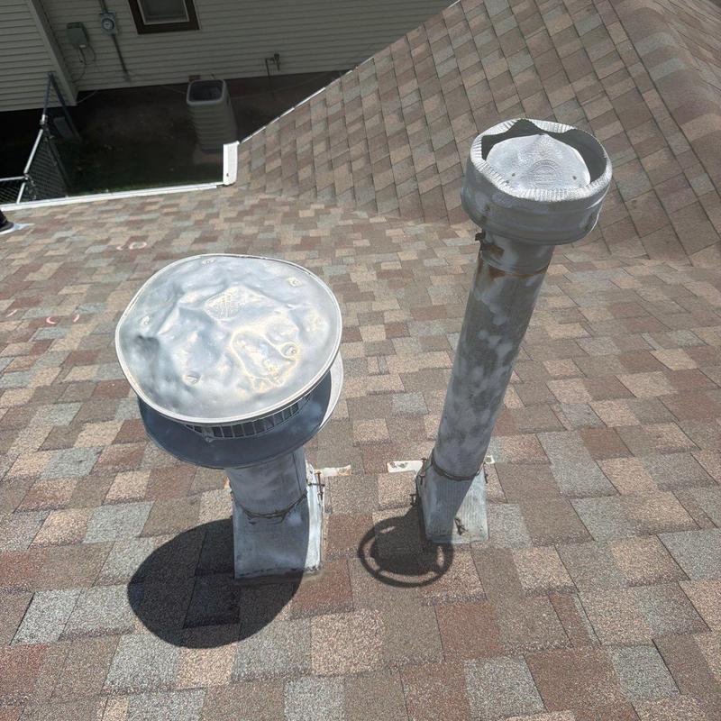 Metal roof vent pipes on asphalt shingle roof in Hastings, NE Metal roof vent pipes on asphalt shingle roof in Hastings, NE
