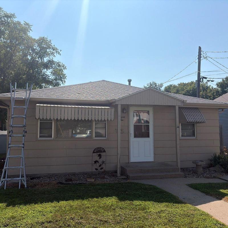 Asphalt shingle roof with ladder for inspection Asphalt shingle roof with ladder for inspection