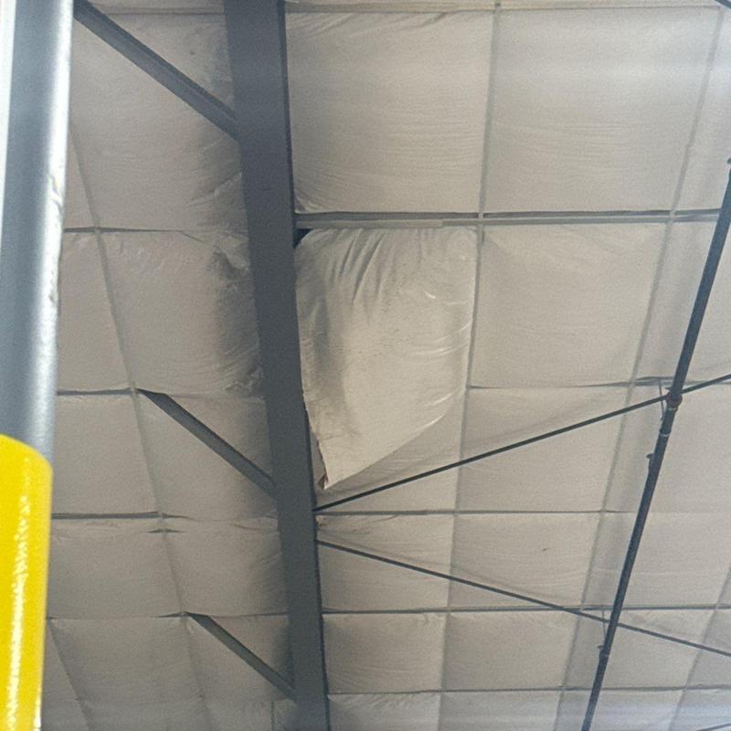 Insulation panels with visible sagging and damage