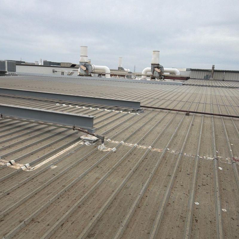Metal industrial roof with ventilation pipes and beams Metal industrial roof with ventilation pipes and beams