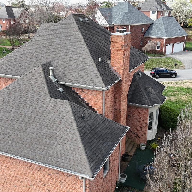Asphalt shingle roof with chimney and vent systems