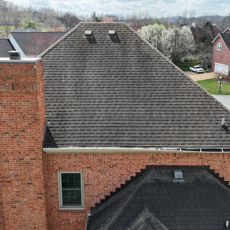 Asphalt shingle roof with hail damage inspection
