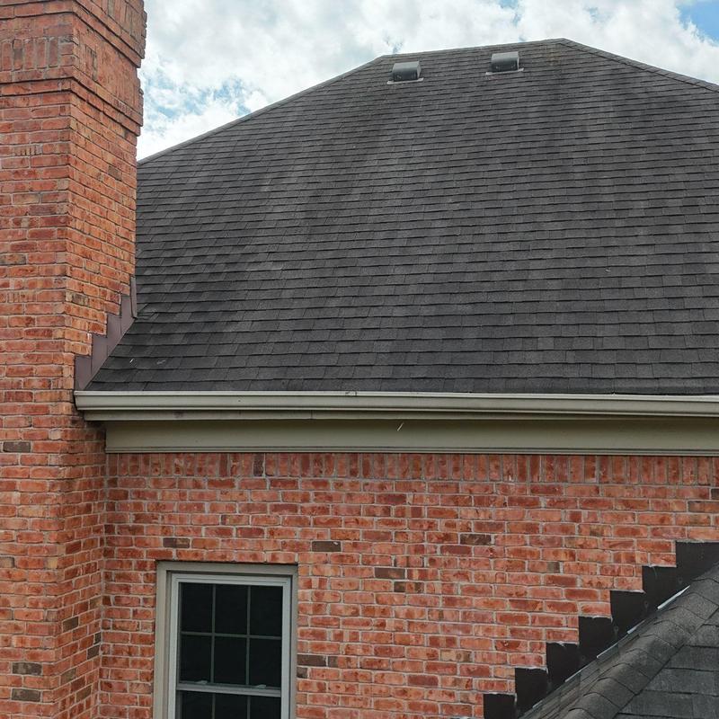 Asphalt shingle roof with hail damage inspection