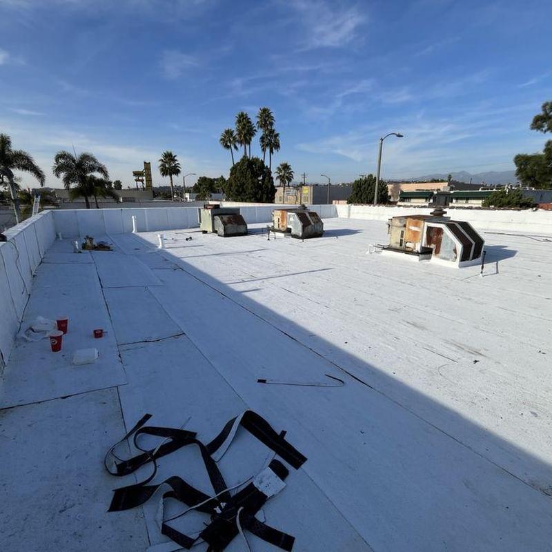 Commercial flat roof with HVAC units and inspection tools Commercial flat roof with HVAC units and inspection tools