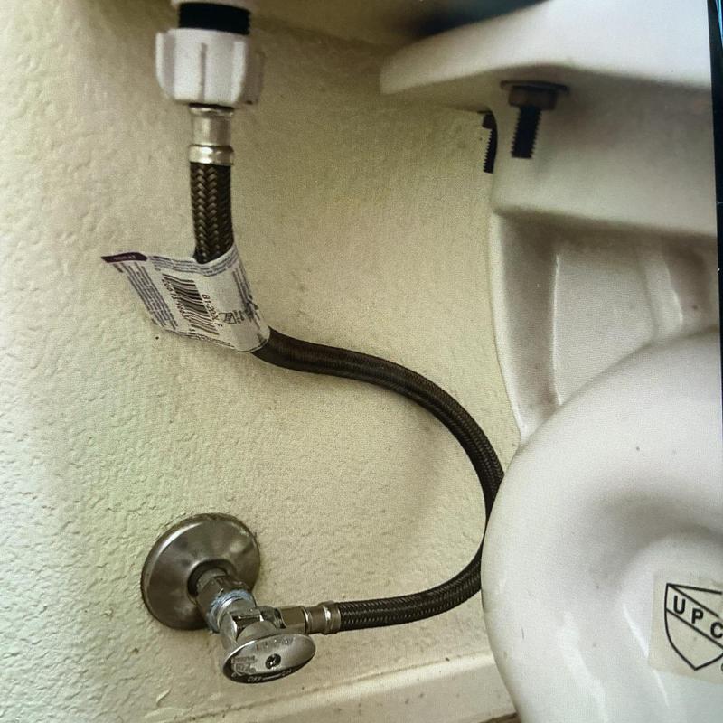 Quarter-turn angle stop with braided supply line under toilet tank Quarter-turn angle stop with braided supply line under toilet tank