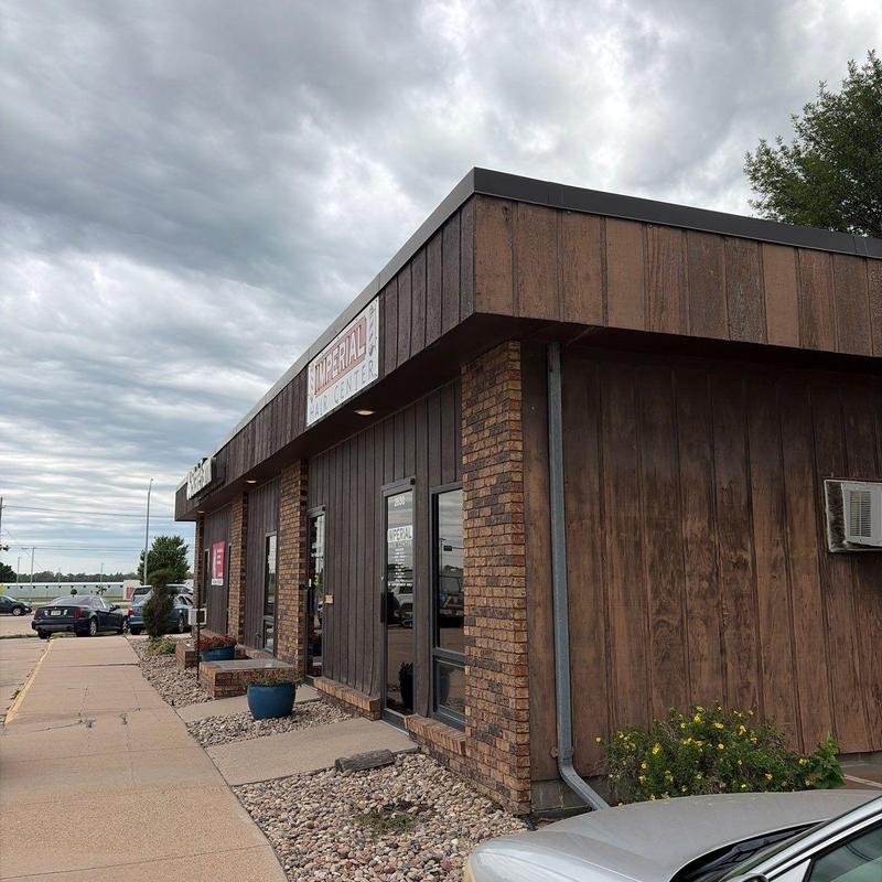 Flat roof inspection on commercial building exterior Flat roof inspection on commercial building exterior