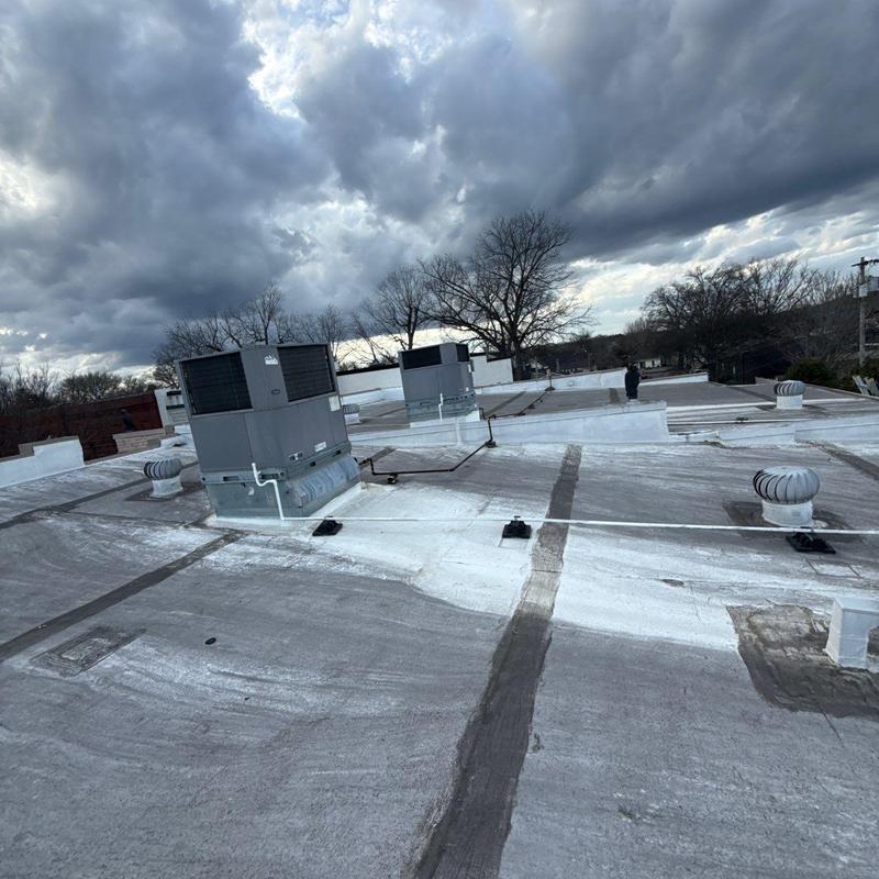 Commercial flat roof with HVAC units and ventilation turbines