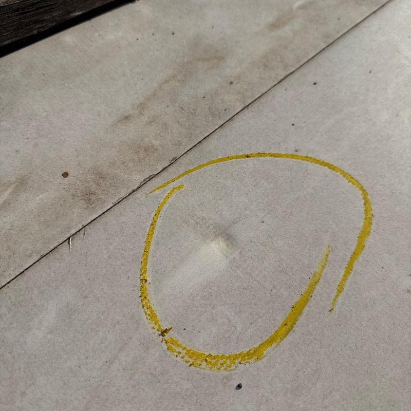 Roof membrane with hail damage marked in yellow