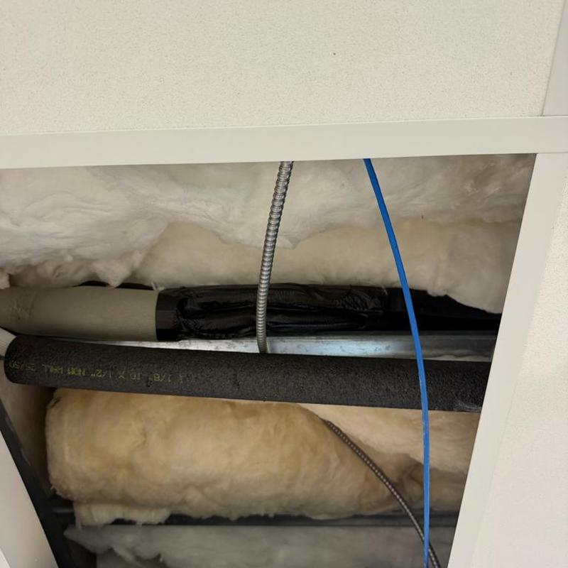 Refrigerant suction line with new insulation above ceiling Refrigerant suction line with new insulation above ceiling