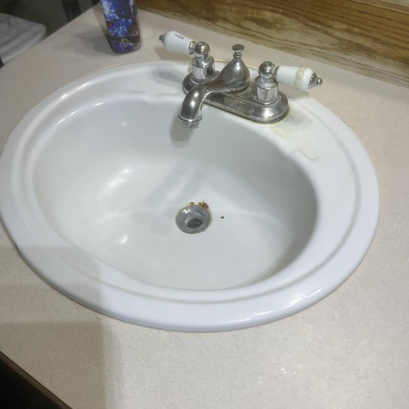 Bathroom sink basin with faucet and rust stains Bathroom sink basin with faucet and rust stains