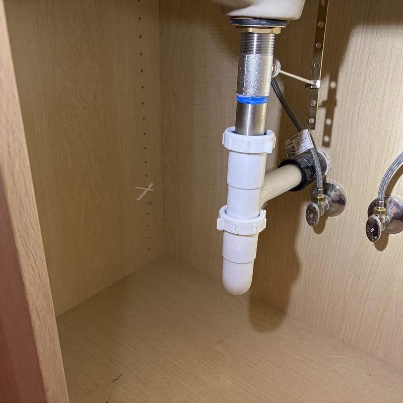 Sink drain trap and water supply valve installation under cabinet Sink drain trap and water supply valve installation under cabinet