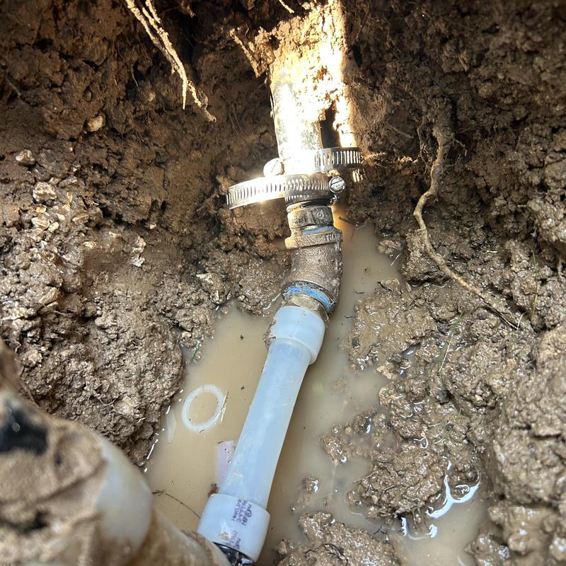 Backflow device piping leak with muddy water outdoors Backflow device piping leak with muddy water outdoors