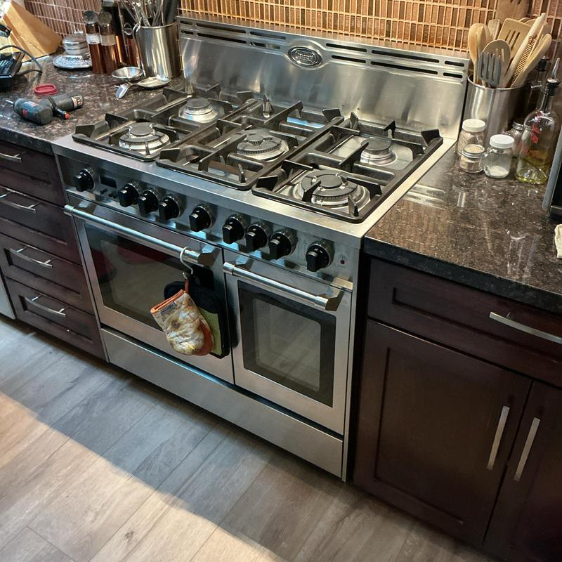 Gas stove with multiple burners and ovens in kitchen Gas stove with multiple burners and ovens in kitchen