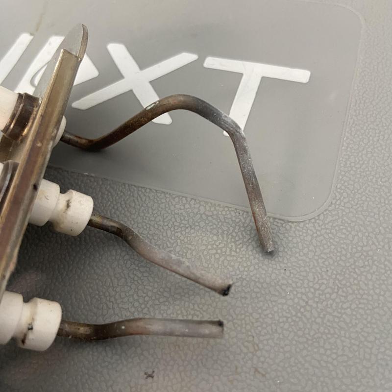 Tankless water heater igniter electrodes close-up Tankless water heater igniter electrodes close-up