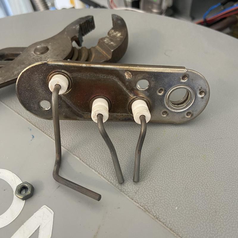 Tankless water heater igniter wires with pliers Tankless water heater igniter wires with pliers