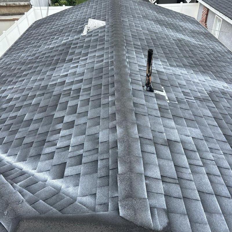 Shingle roof with vent pipe and chimney flashing Shingle roof with vent pipe and chimney flashing